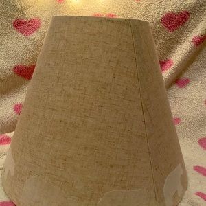 Tan lamp shade with bears along rim.